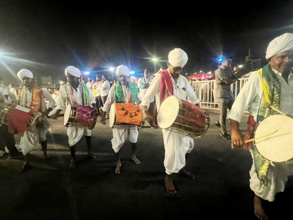 Night view of Avakai Amaravati Festival stage with CM, ministers and foreign delegates present

