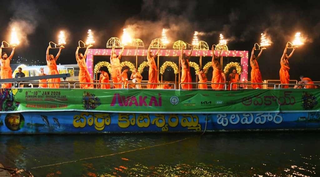 Illuminated Avakai Amaravati Festival venue on Krishna river bank in Amaravati